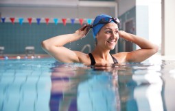 Smiling woman in a swimming pool